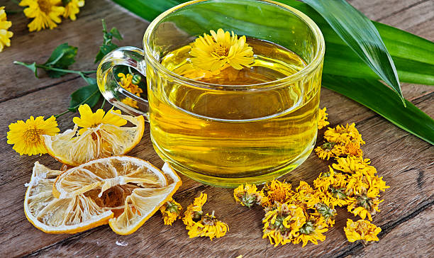 istock Chrysanthemum tea is a herbal drink on a wooden table. 2250418400