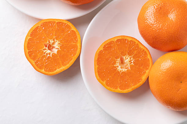 istock Mandarin orange fruit on white plate with white background 2250423949