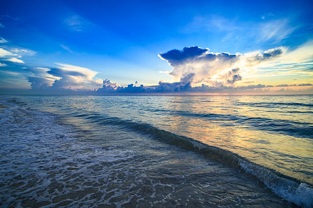 Sea sunset with sky and sun through the clouds over. Ocean and sky background, seascape.