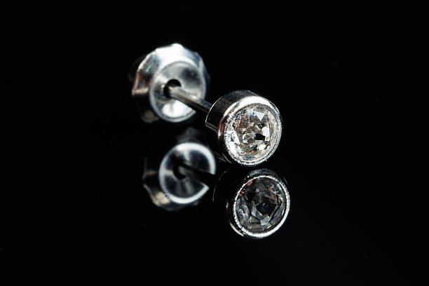 Close-up of diamond necklace on a black background.