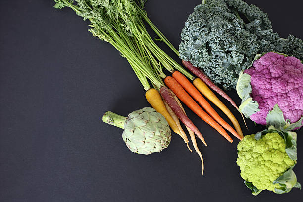 istock Fresh organic vegetables assortment on a black background. 2250437254