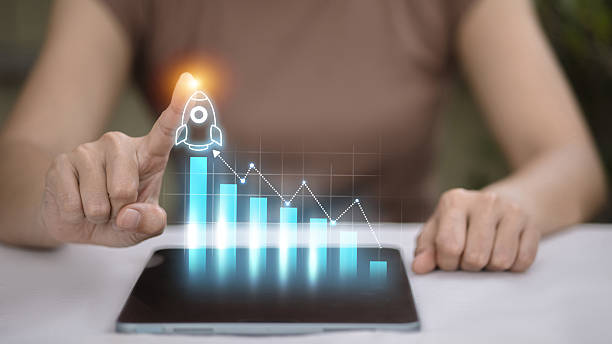 istock Business growth concept with rocket launching from digital bar graph 2250440912