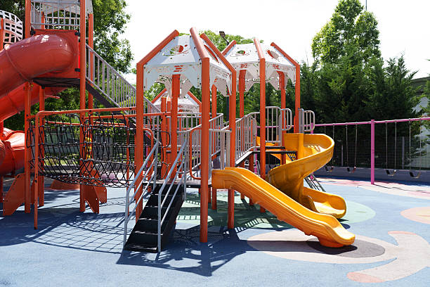 istock Colorful empty playground equipment in a public park 2250443233