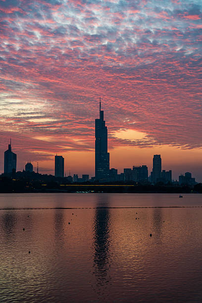 istock Colorful Clouds Over City Skyline at Sunset 2250444048