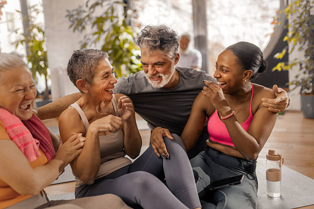 istock Older adults enjoying a friendly post workout conversation with their fitnes coach 2250447738