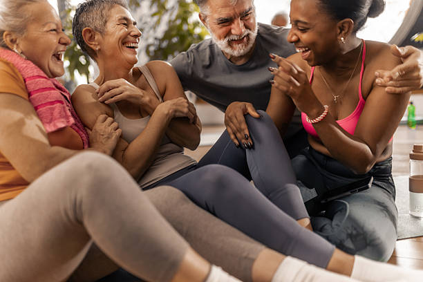 istock Older adults enjoying a friendly post workout conversation with their fitnes coach 2250447739