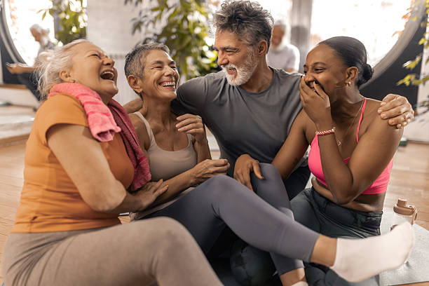 istock Older adults enjoying a friendly post workout conversation with their fitnes coach 2250447763