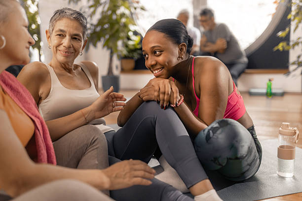 istock Older adults enjoying a friendly post workout conversation with their fitnes coach 2250447767