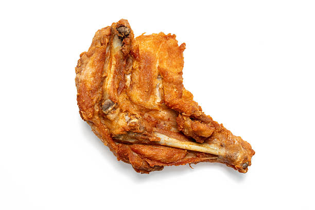 istock Fried chicken thighs on isolated white background. 2250455372