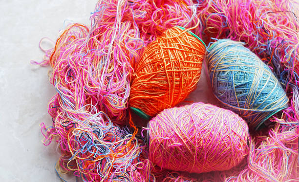 istock Woolen threads of different colors stand in rows 2250456977