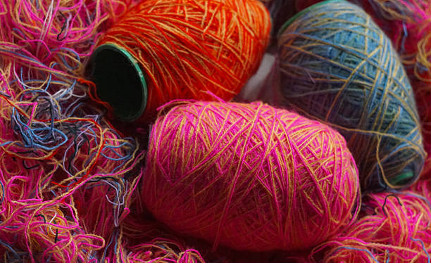 istock Woolen threads of different colors stand in rows 2250457016