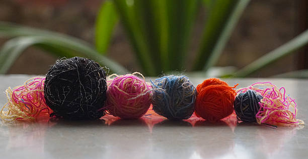 istock Woolen threads of different colors stand in rows 2250457067