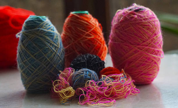 istock Woolen threads of different colors stand in rows 2250457069