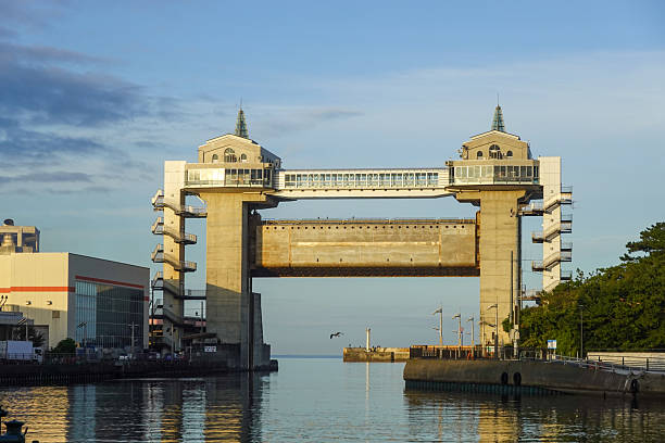 istock Large harbor floodgate structure above calm water channel 2250459763