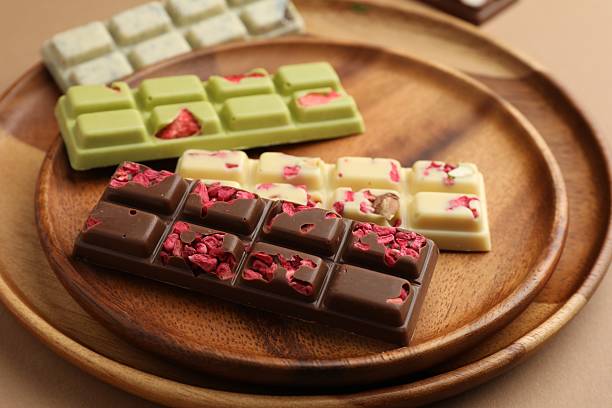 istock Different tasty chocolate bars on beige background, closeup 2250471705