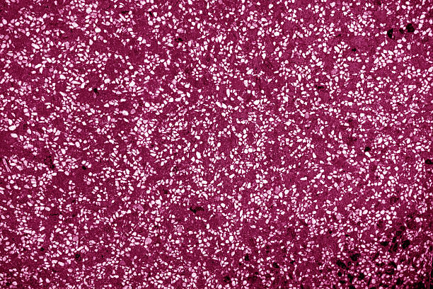 istock Decorative pink cement floor or wall with small stones structure. 2250472354