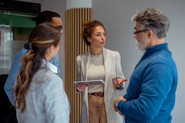 istock Intergenerational Team Meeting: Female Leader Presenting Ideas with Tablet 2250472364