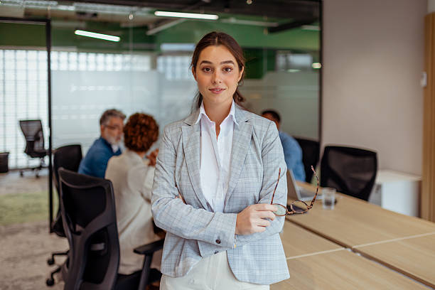 istock Confident Businesswoman Looking at Camera while Smiling in Modern Office 2250472535