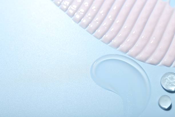 istock Cream and gel samples on light blue background, top view. Space for text 2250476758