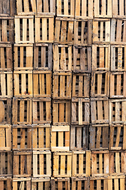 Plastic fruit crates in warehouse.