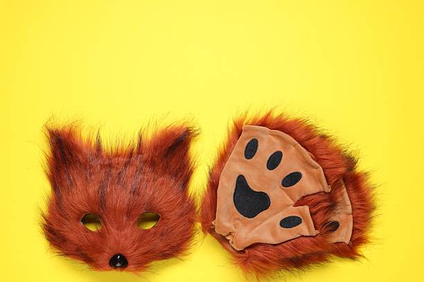 istock Quadrobics. Fox mask and gloves on yellow background, top view. Space for text 2250477741