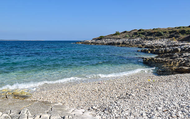 istock Beautiful pebble beach surrounded with rocks at Cape Kamenjak 2250478170