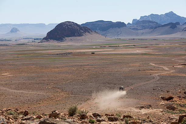 istock 4x4 crosses a dusty plateau 2250486654