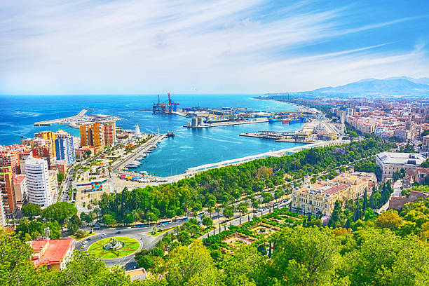 Malaga cityscape with Cathedral of Malaga and harbor, Spain