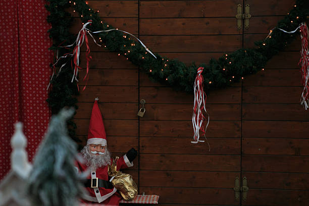 Christmas tree and Santa Clause decoration ornament  in Christmas market during December in Piazza Santa Croce, Florence, Italy