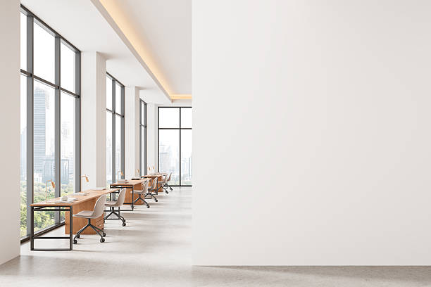 istock Modern office interior with large windows and empty white wall for poster or canvas mockup presentation in bright minimalist design concept layout. 3D Rendering 2250495539
