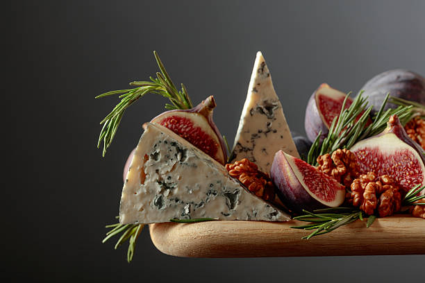 istock Blue cheese with figs, walnuts, and rosemary. 2250498061