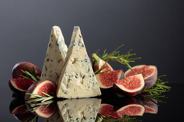 istock Blue cheese with fresh figs and rosemary on a black background. 2250498062