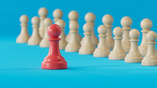 istock Solo Red Pawn Apart From Beige Pawn Line: Symbolizing Individual Uniqueness 2250498596