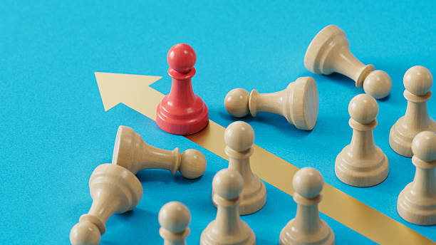 istock Red Pawn, Gold Arrow: Embodying Victory and Advancing Success 2250498630