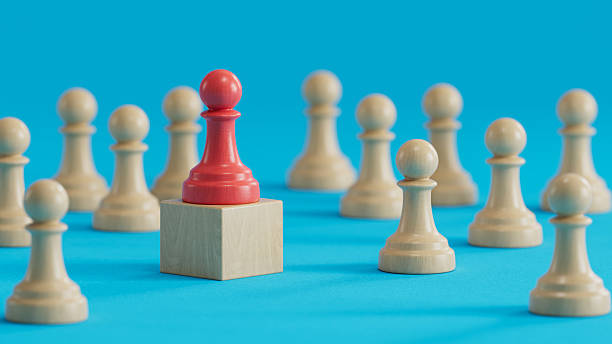 istock Red Pawn On Block: Distinction and Leadership Among Peers 2250498652