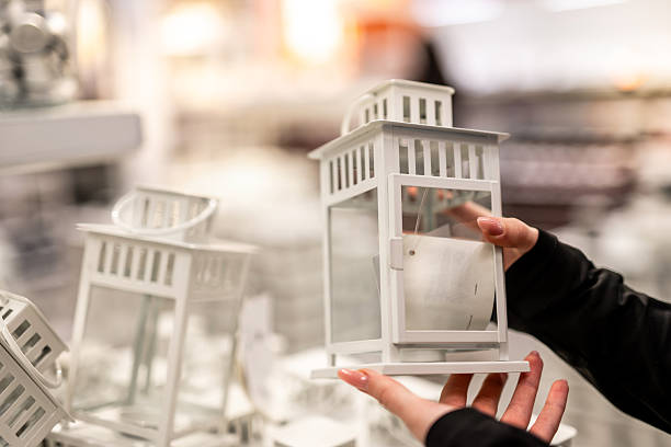 Woman Chooses A Lantern For Candles In A Store Close-Up