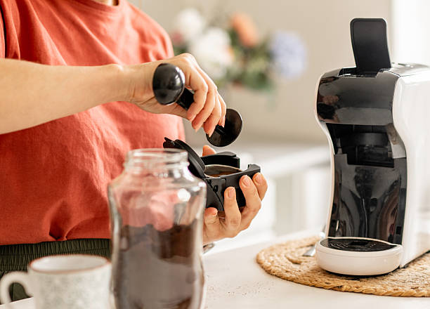 istock Woman Making Coffee In Coffee Machine 2250500205