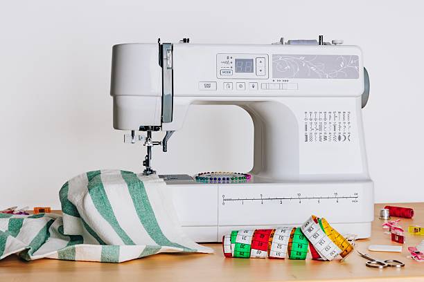 istock A Modern Sewing Machine Surrounded by Colorful Measuring Tapes and Fabric for Crafting Enthusiasts and Tailors 2250501204