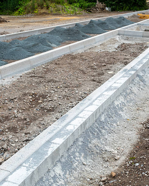 istock a new road with carriageway and sidewalk is being built 2250503639