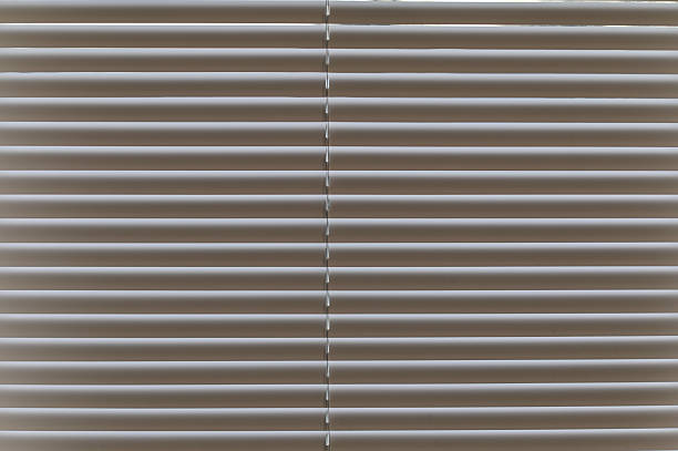 istock Decorative White Window With Traditional Vertical Blind Slats Closed. 2250504247