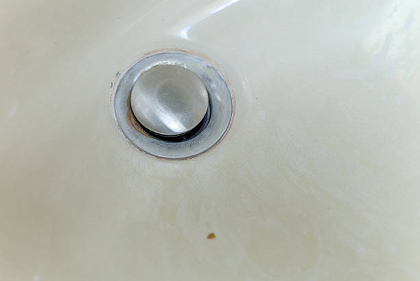 istock Clogged Bathroom Sink Drain With Mineral Deposits Stains. 2250504278
