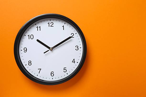 istock Big beautiful stylish clock on color background 2250509146