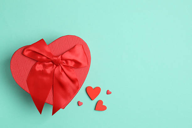 istock Gift box with red hearts on black background. Valentine's Day 2250509860