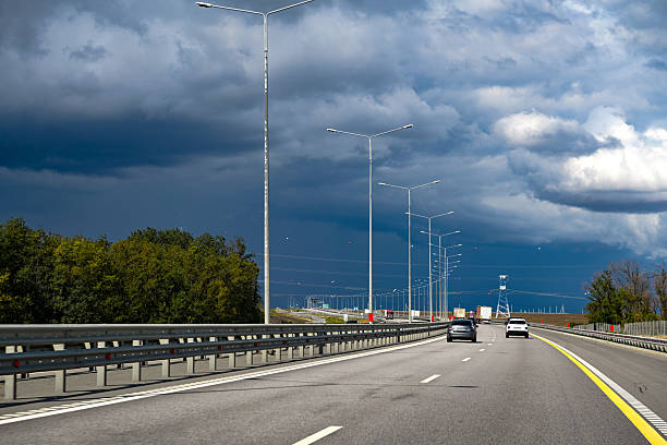 view of storm clouds and rain over the highway