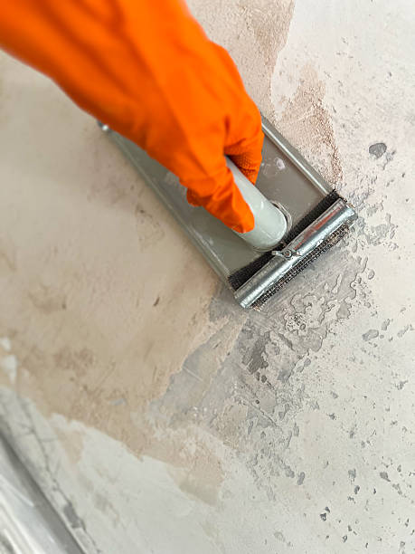 istock Hand sanding wall surface for renovation and repair 2250511325
