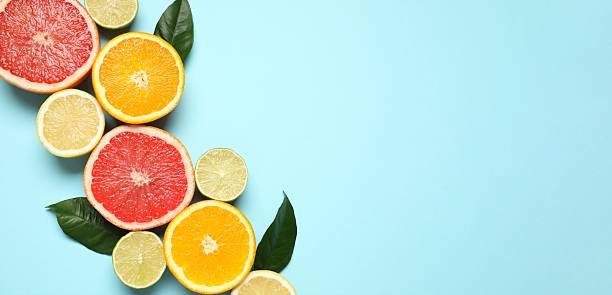 istock Tropical fruits on a colored background. Summer concept. Flat lay, top view 2250512579