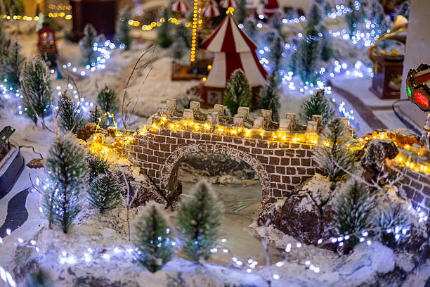 istock Miniature Snowy Winter Village with Festive Bridge Lights 2250512794