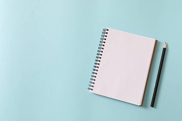 istock Flat lay with pencil and notebook on color background, top view 2250513154