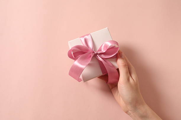 istock Beautiful gift box on color background 2250513369