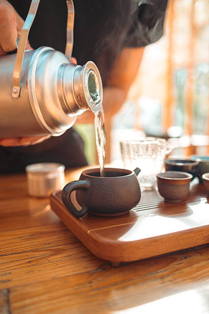 istock Traditional Tea Ceremony Pouring From Clay Teapot Close-Up 2250513732